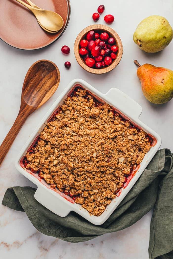 overhead shot of a cranberry pear crisp in a baking dish