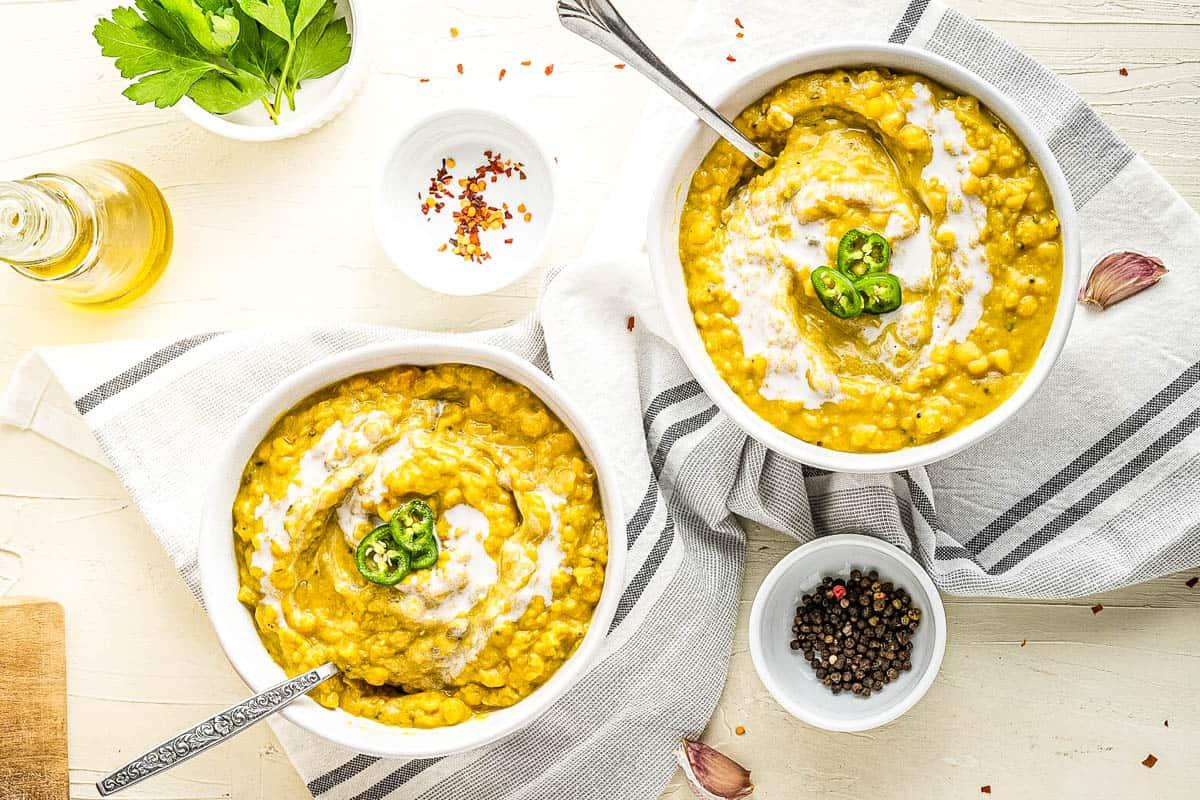 overhead shot of prepared lentils with indian spices in bowls