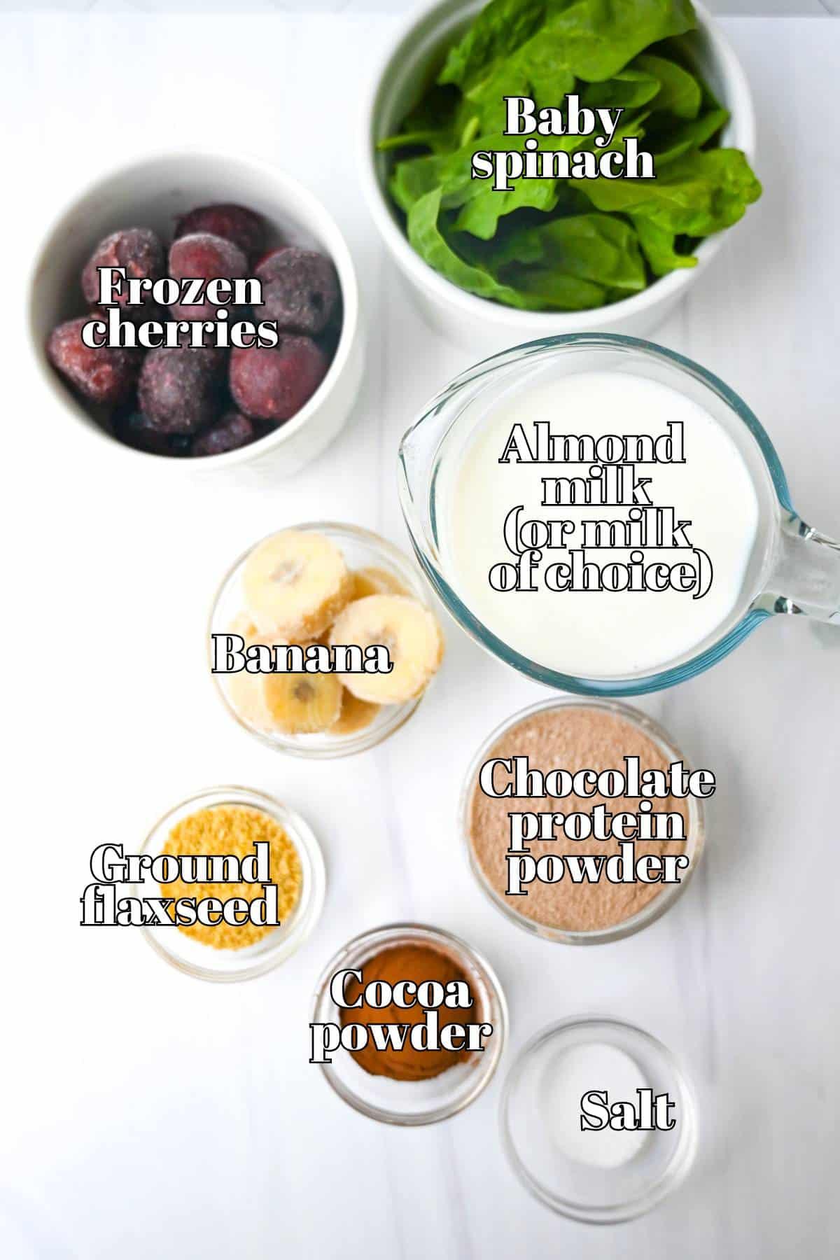 ingredients for cherry chocolate protein smoothie laid out on a kitchen counter