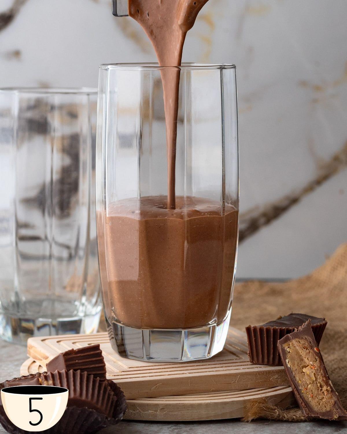 blended peanut butter virgin mojito being poured into a glass
