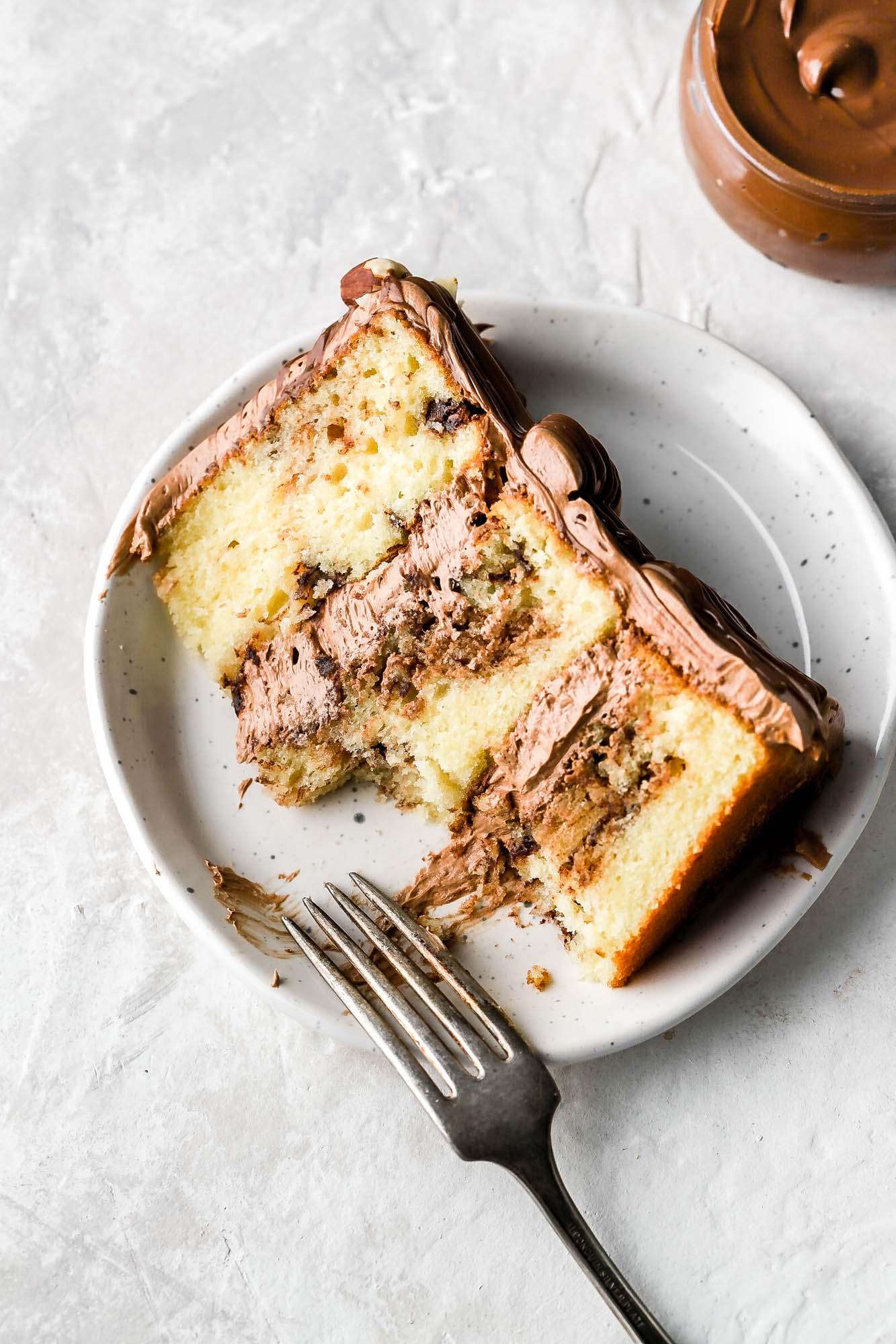 close up of a slice of vanilla nutella swirl cake