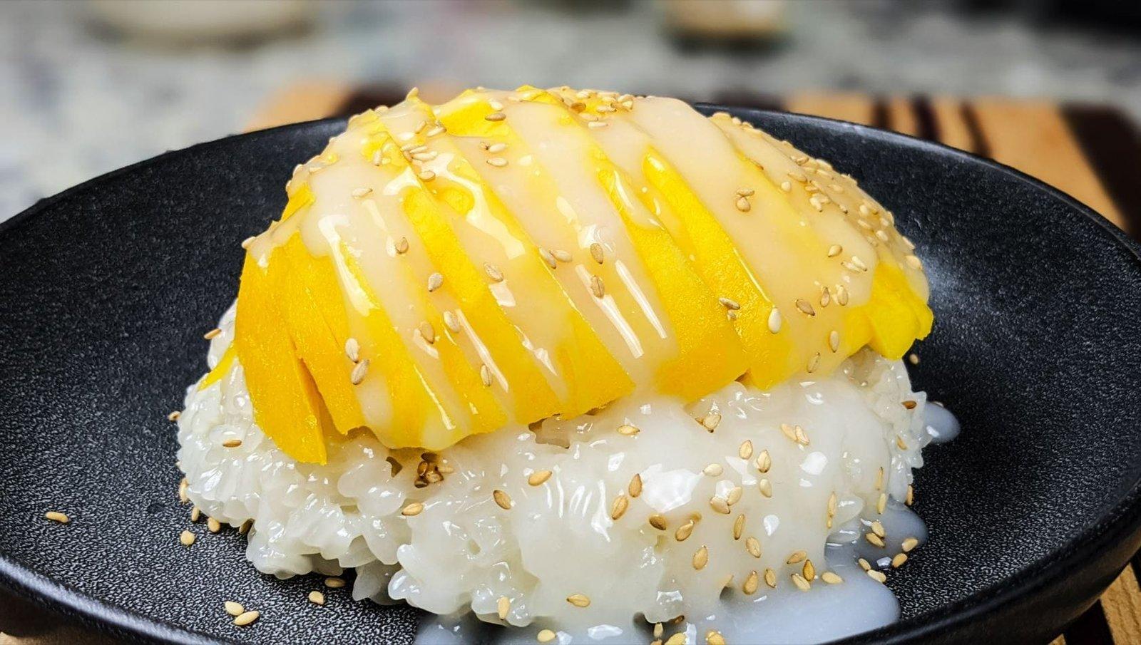 close up shot of a mango sticky rice parfait