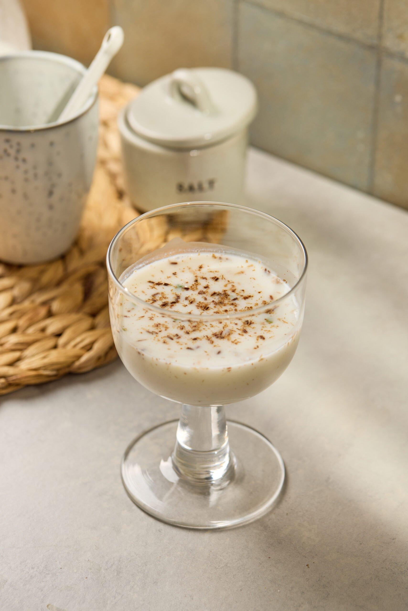 a person blending a ginger lassi