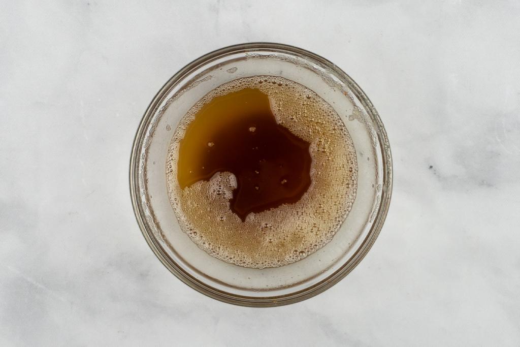 brown butter being poured into a bowl