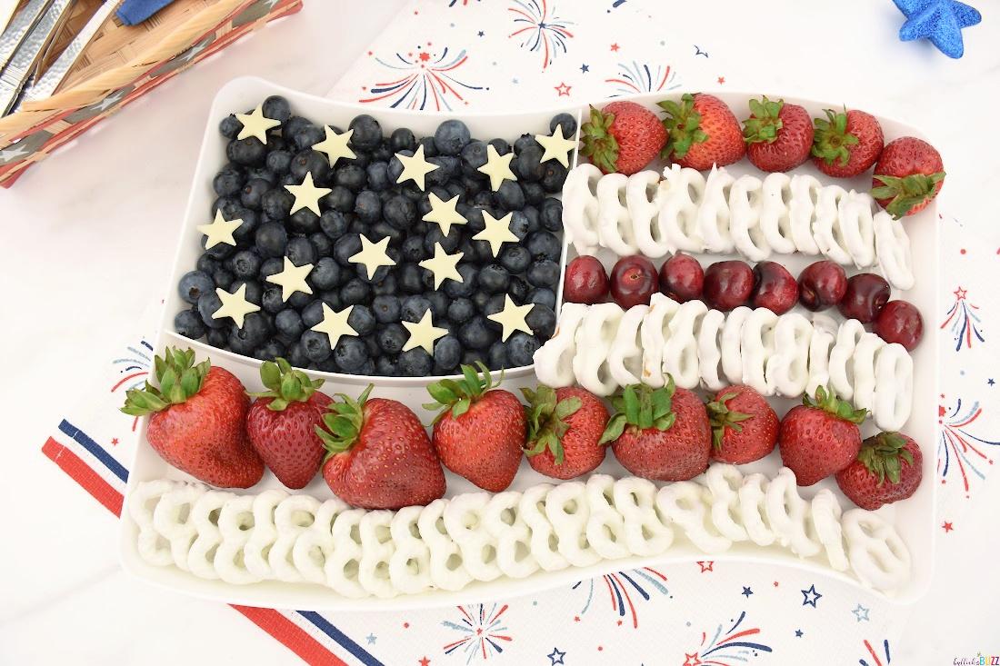 close up of an American flag fruit platter with various berries and bananas