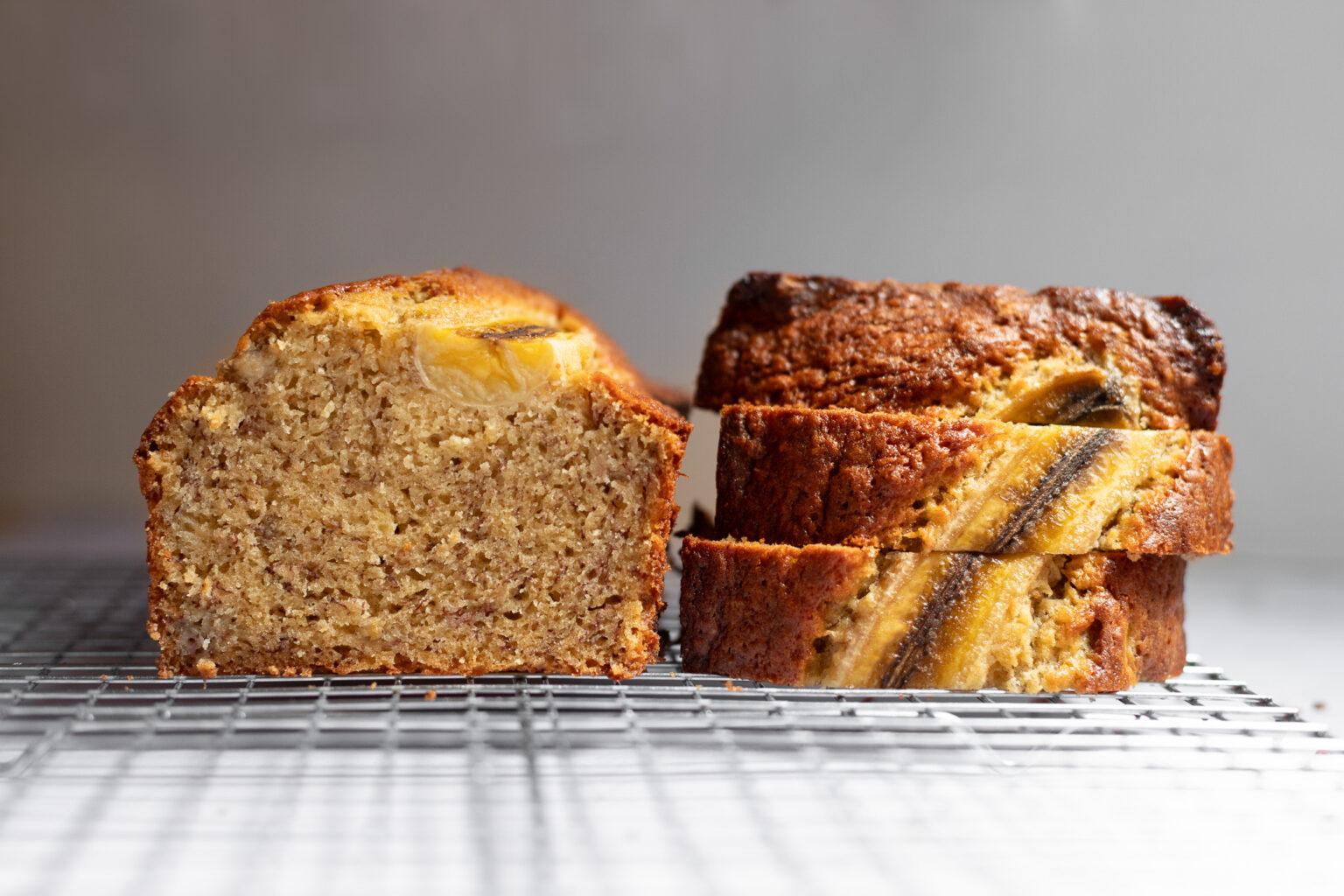 sliced cardamom banana bread next to a cup of tea