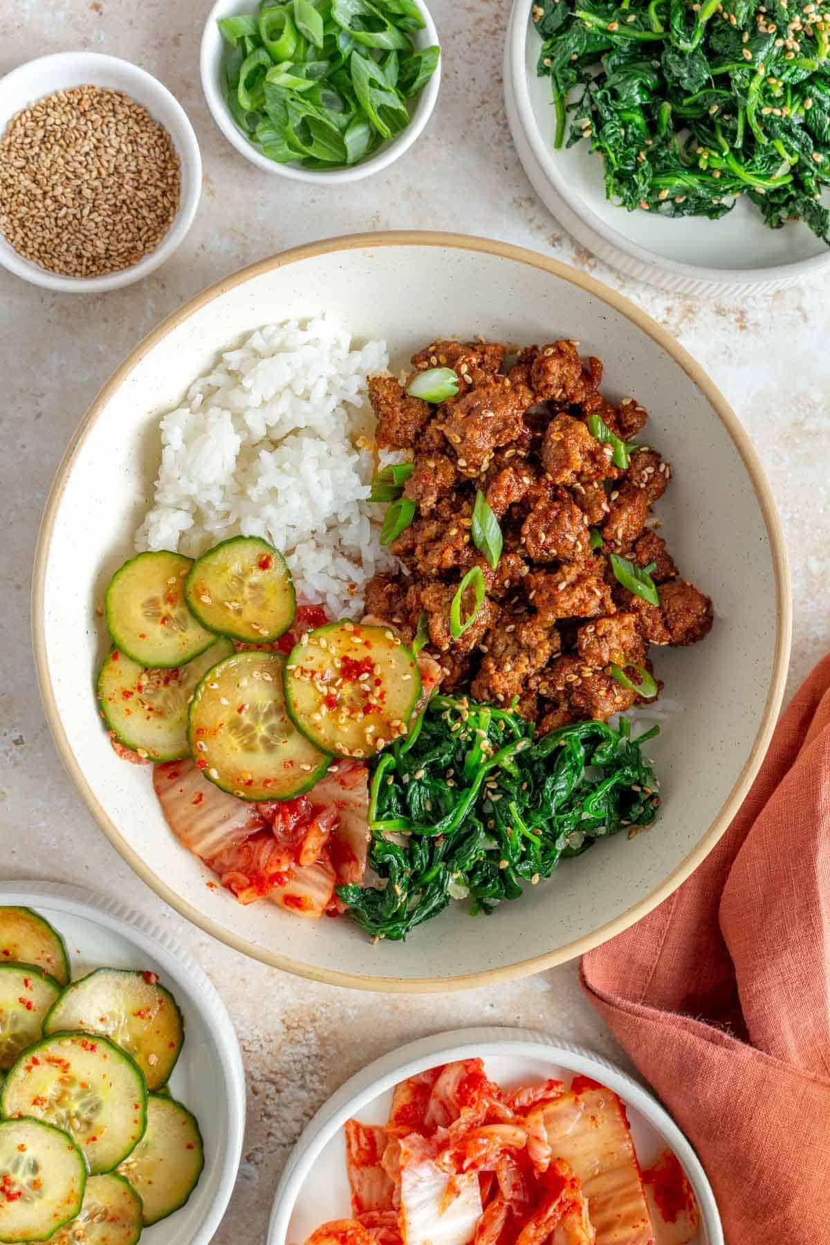Overhead shot of the completed Gochujang Beef Stir-Fry and Asian Slaw, arranged on a plate