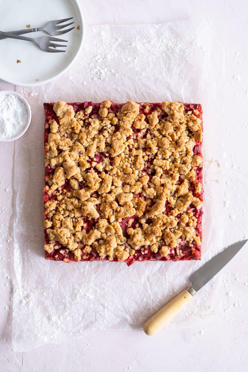 a close-up shot of the bread's crumb texture, showcasing the rhubarb and hazelnuts