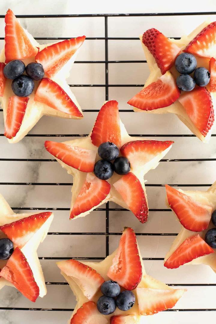 a batch of patriotic star cookies on a cooling rack