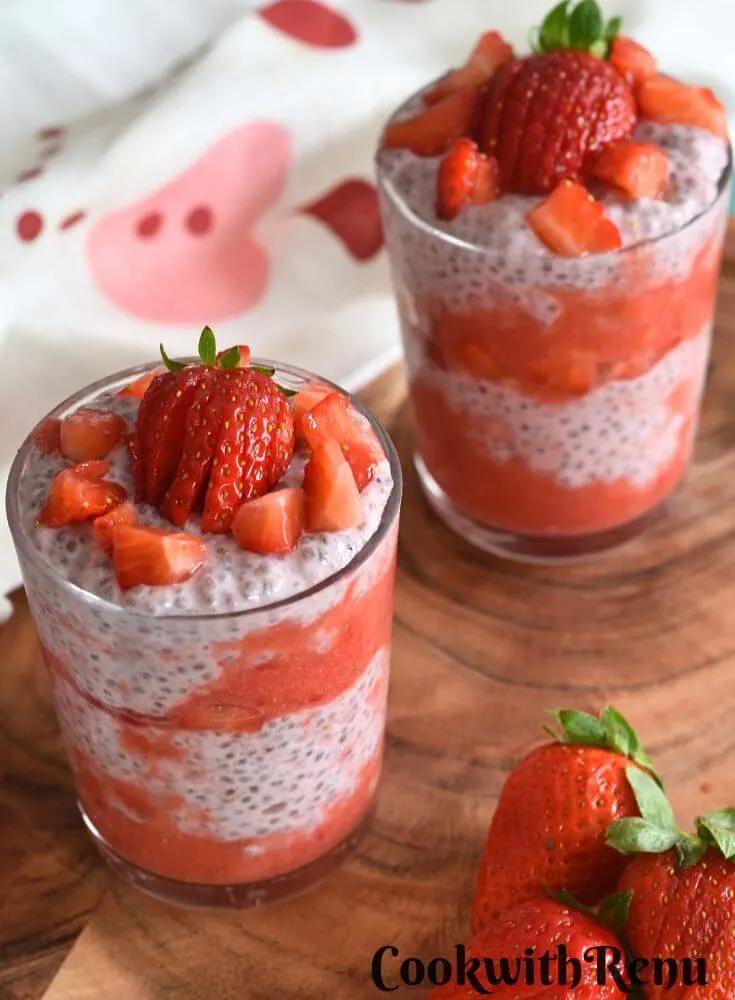 close up of layers of strawberry chia seed pudding in a glass