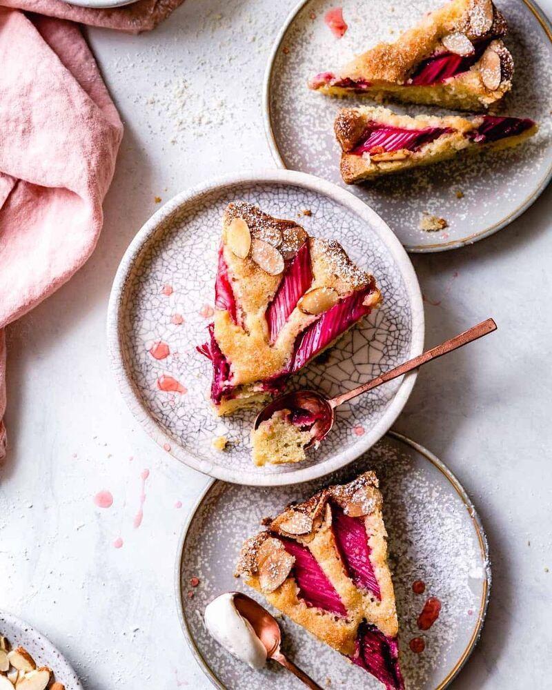 Rosemary Rhubarb Olive Oil Cake on a rustic wooden table