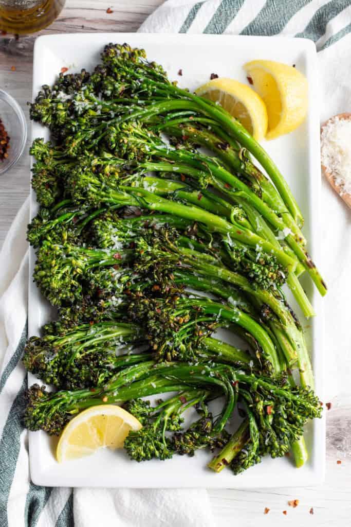close up shot of grilled broccolini with visible garlic and red pepper flakes