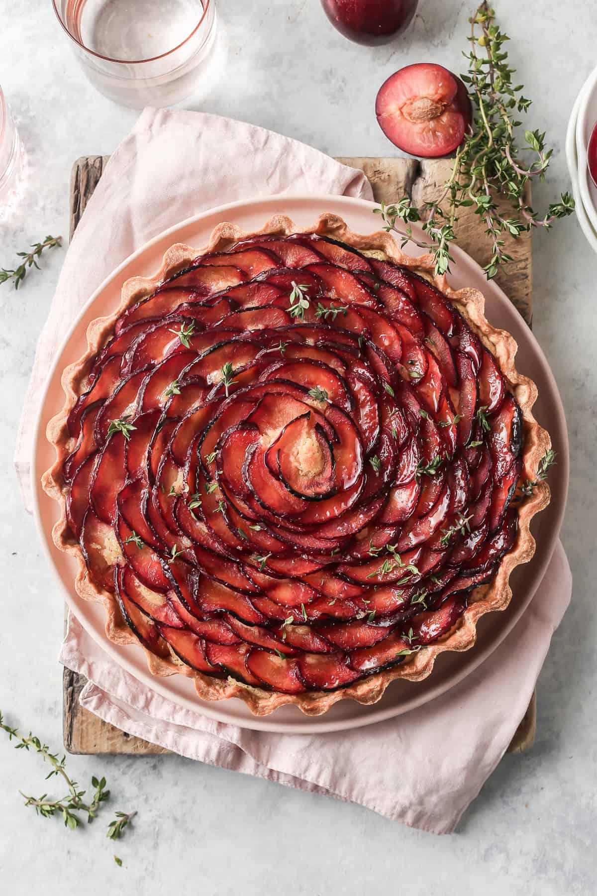 ingredients for cherry plum and almond tart arranged on a kitchen counter