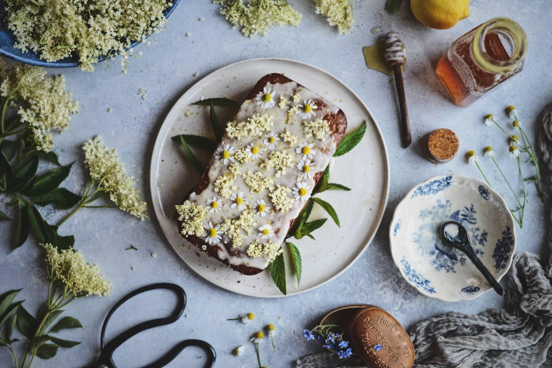 Ingredients for Elderflower Vanilla Cake on a wooden table