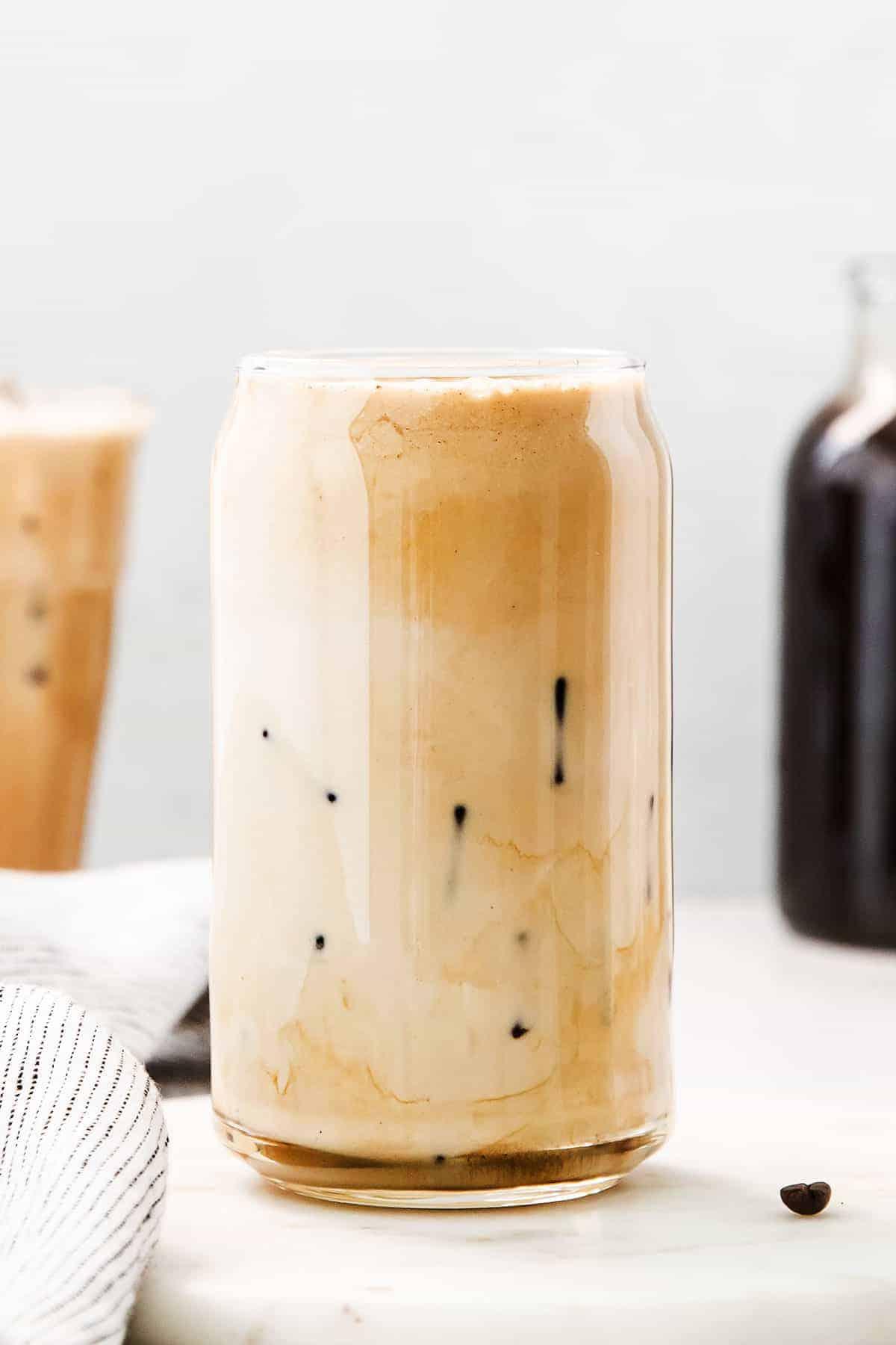 person enjoying a glass of vanilla bean cold brew