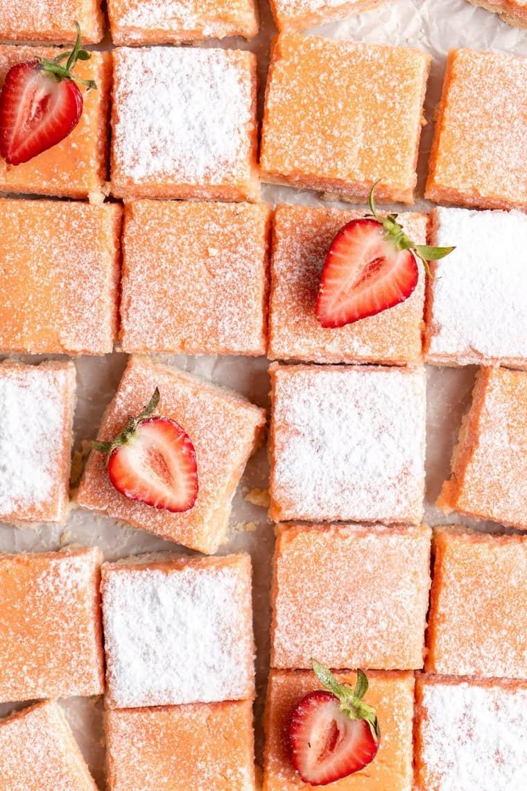 Strawberry Lemonade Bars being cut into squares
