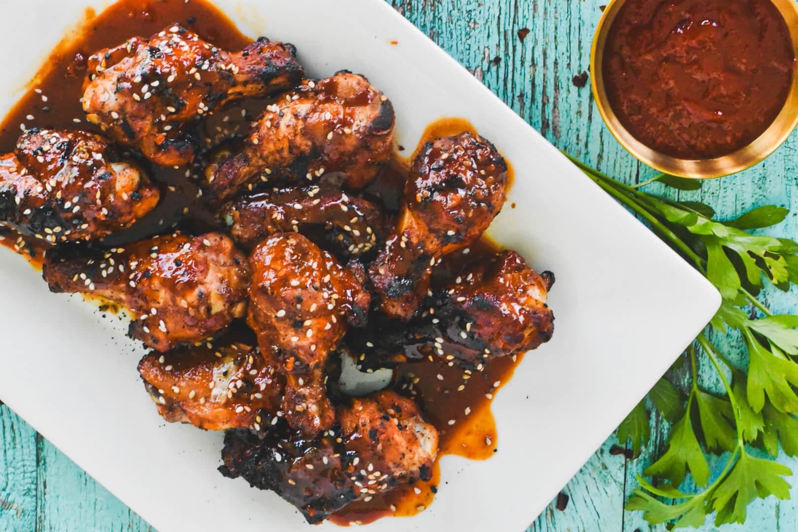 Korean Gochujang Barbecue Chicken Wings served on a plate with sesame seeds