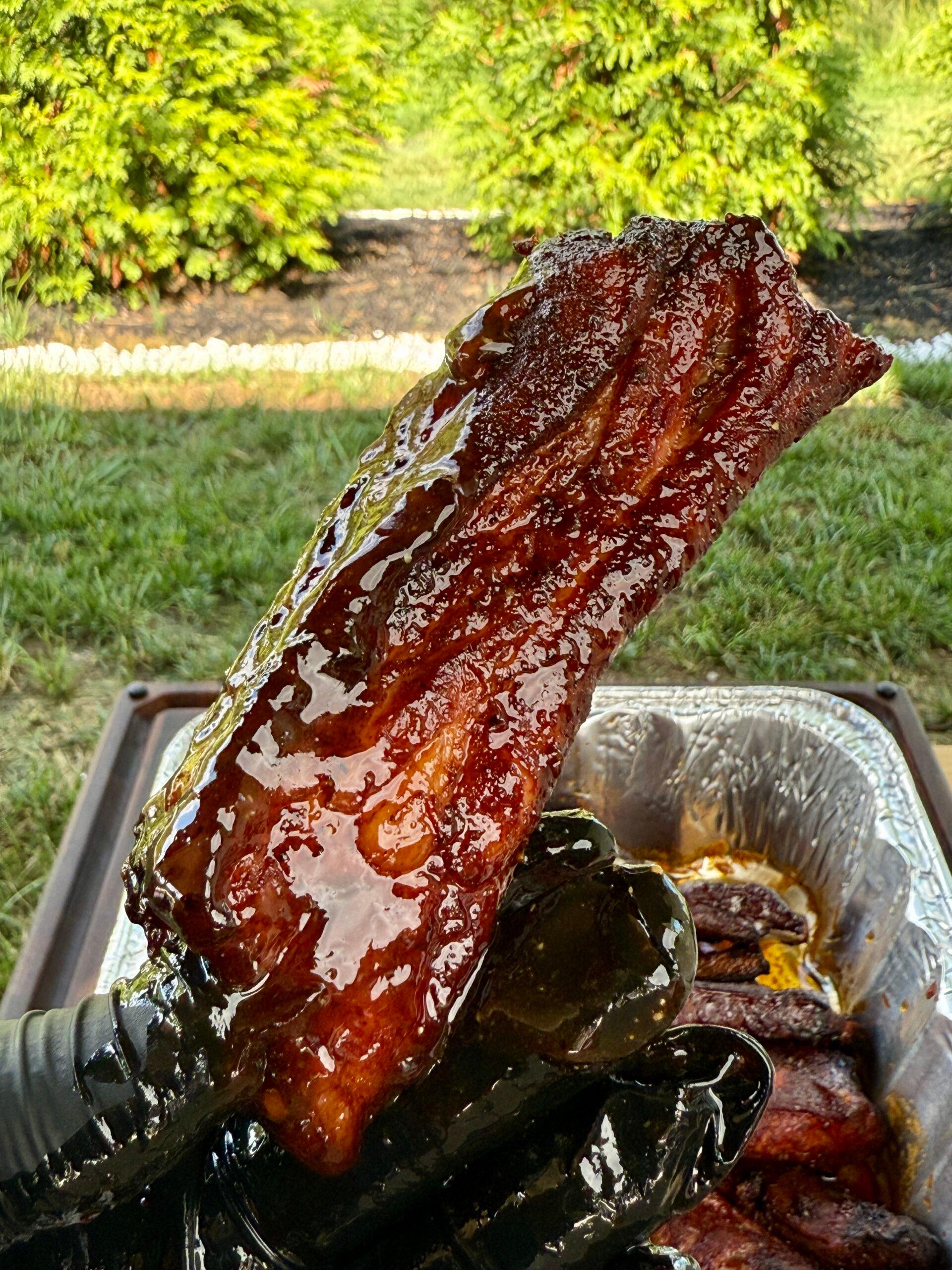 close up of mango serrano glazed ribs on a grill