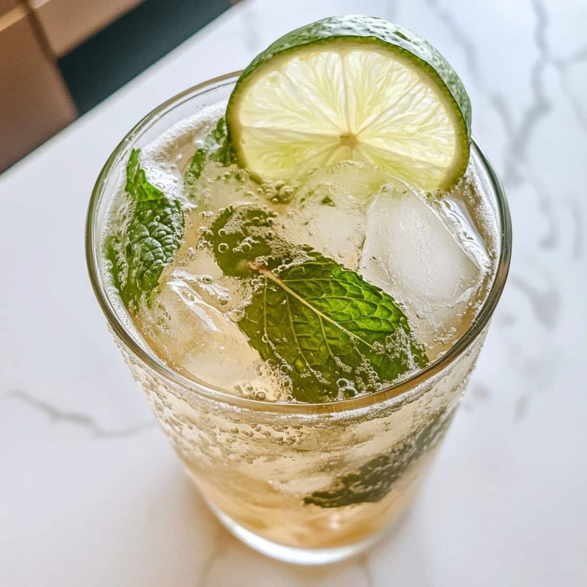 close up of golden yellow virgin mojito in a glass