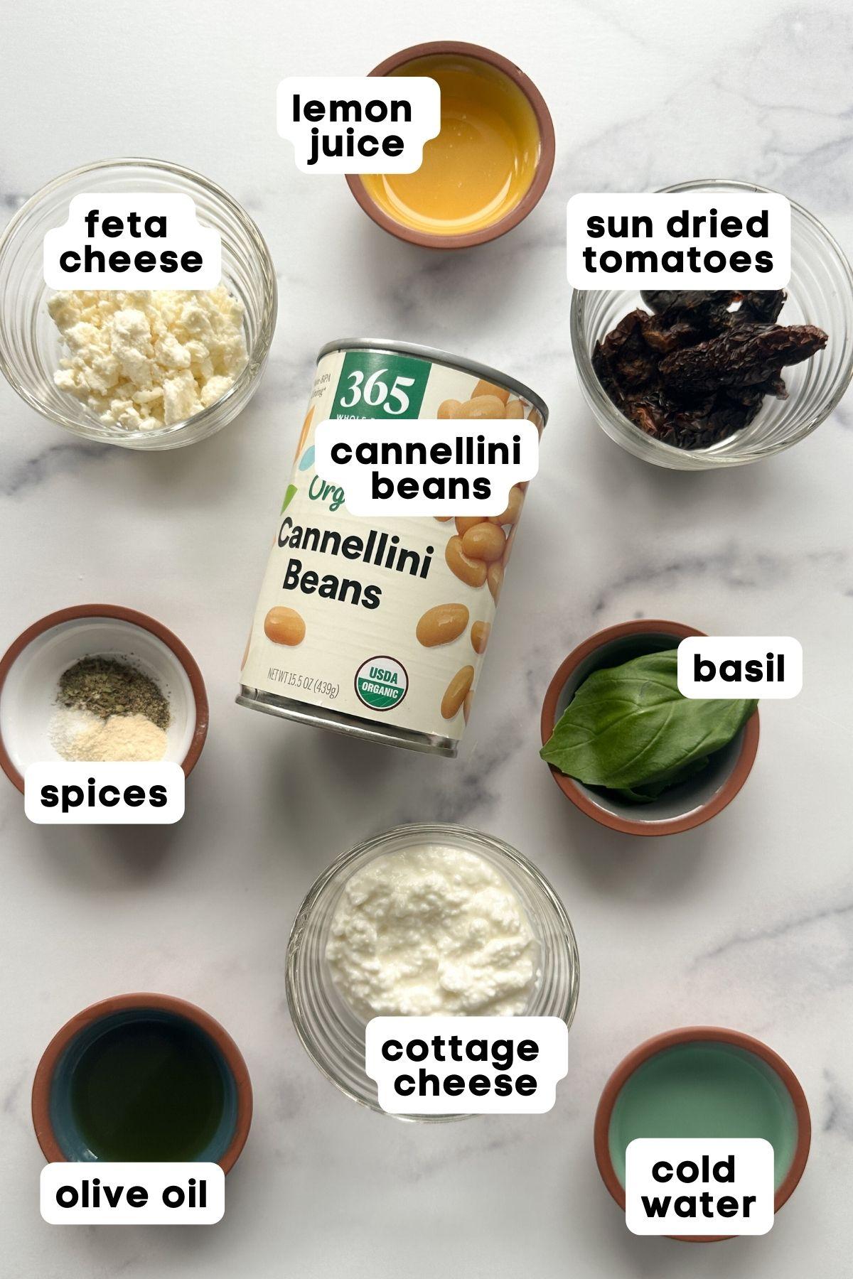 Ingredients for sun-dried tomato cottage cheese pancakes laid out on a wooden table