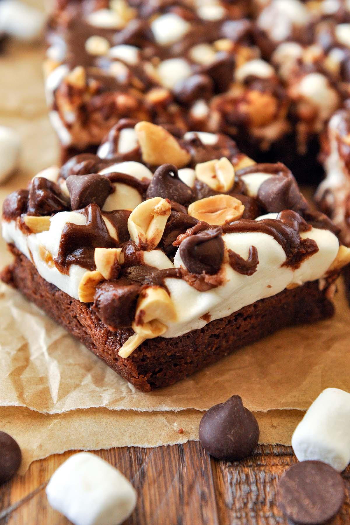 close up shot of a sliced rocky road brownie showing marshmallows and nuts