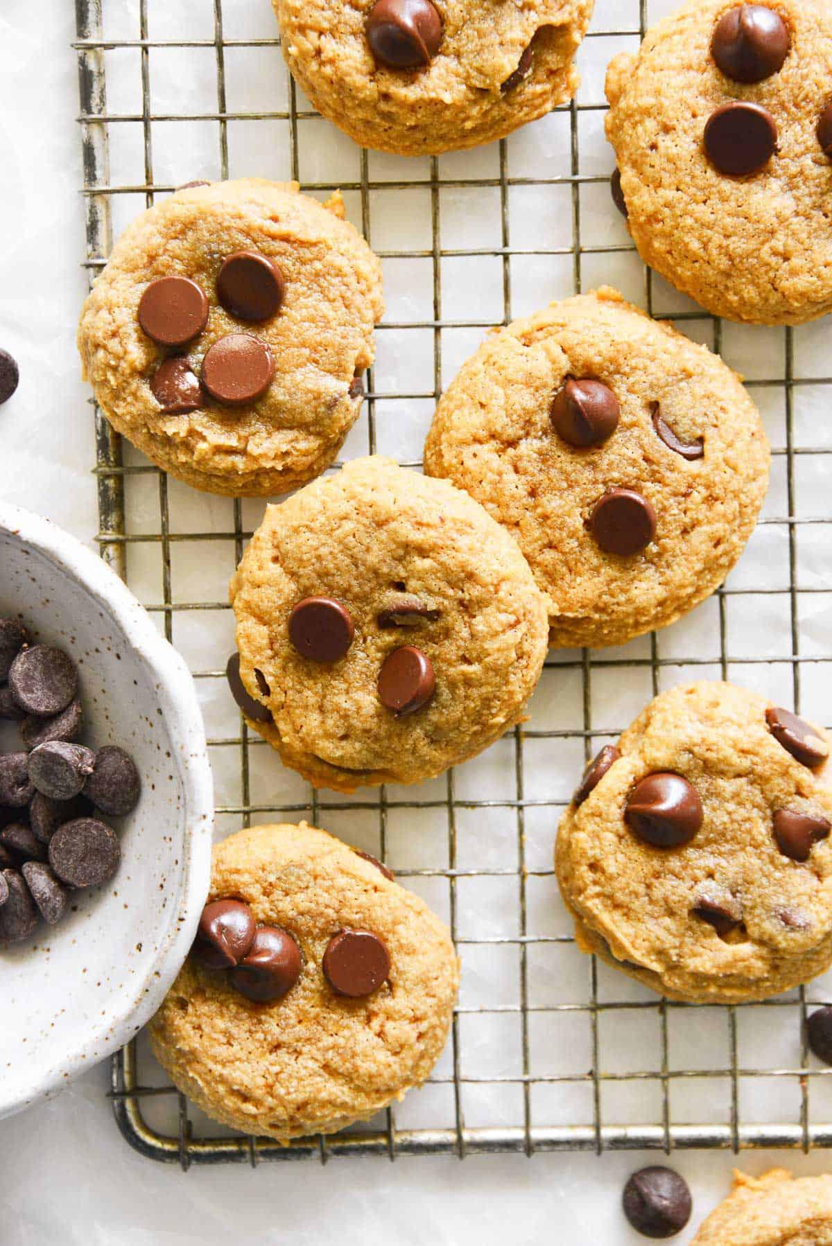 freshly baked keto espresso chocolate chip cookies on a cooling rack