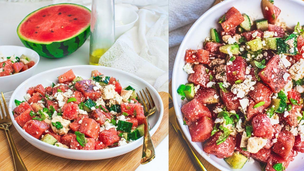 grandmother serving watermelon salad to her granddaughter