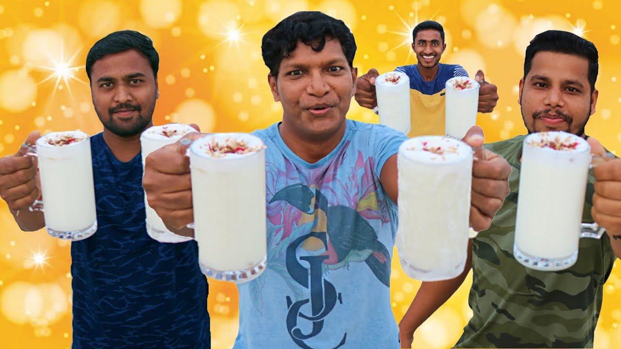 A person happily drinking Currant Craze Lassi outside.