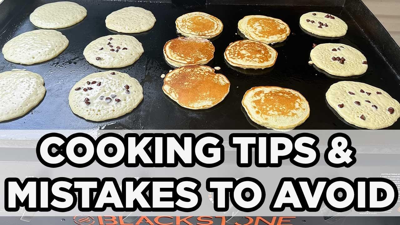 pancakes being flipped on a griddle
