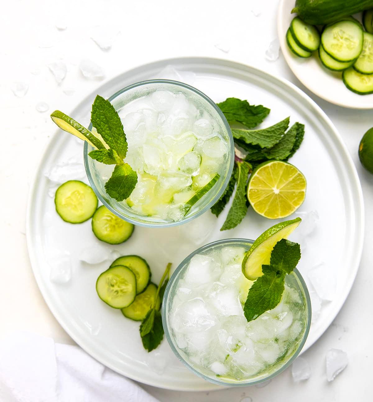 overhead shot of multiple glasses of cucumber mint refresher with condensation
