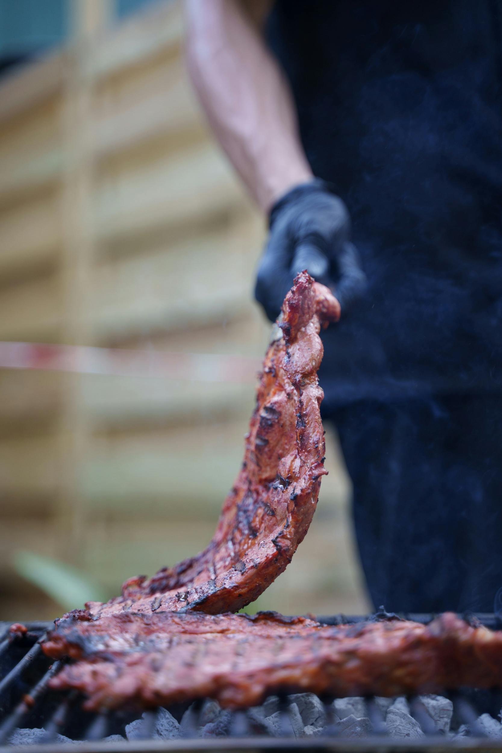 close up of ribs being grilled