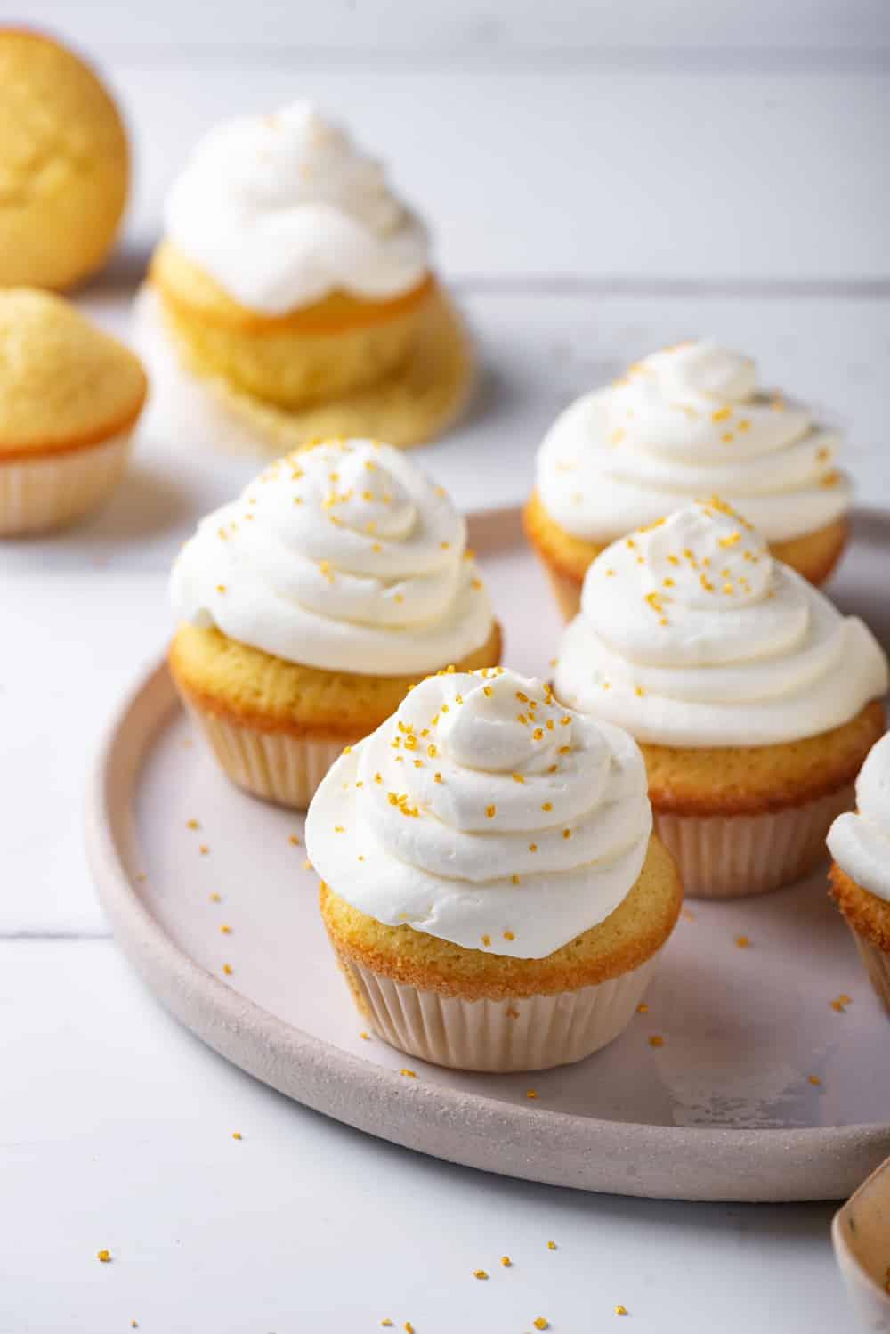keto vanilla cupcakes with cream cheese frosting on a plate