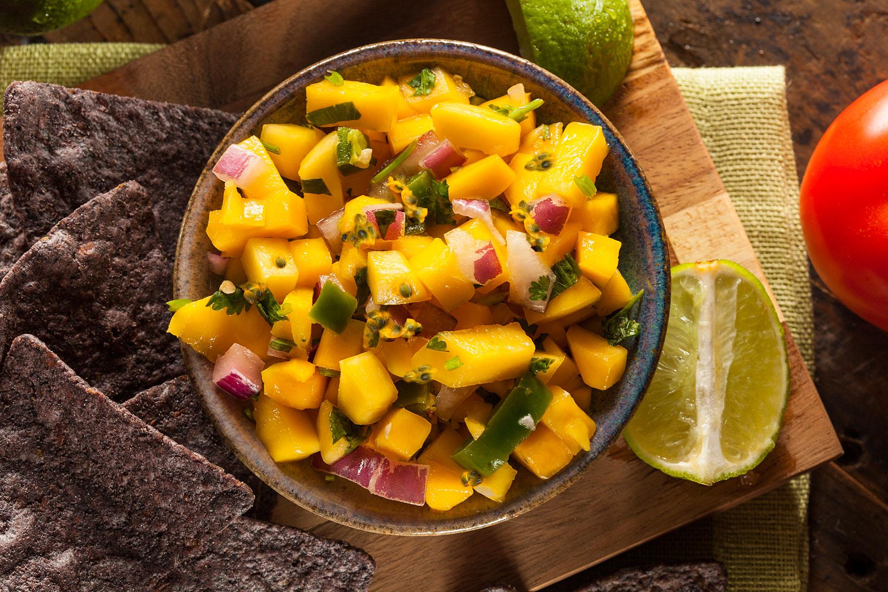close up of a bowl of passion fruit mango salsa