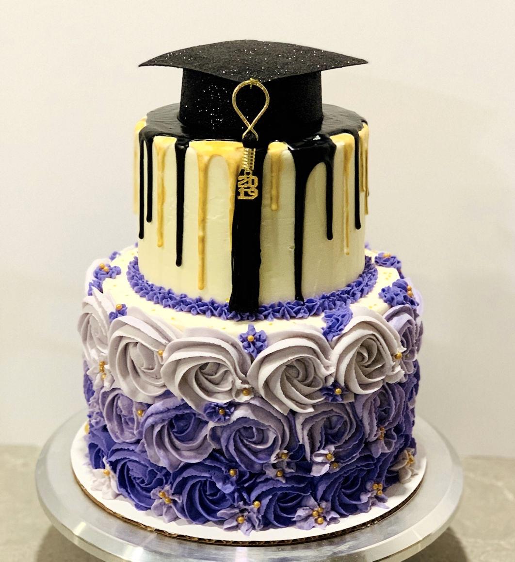 close-up of a slice of graduation cake with a class photo, being served
