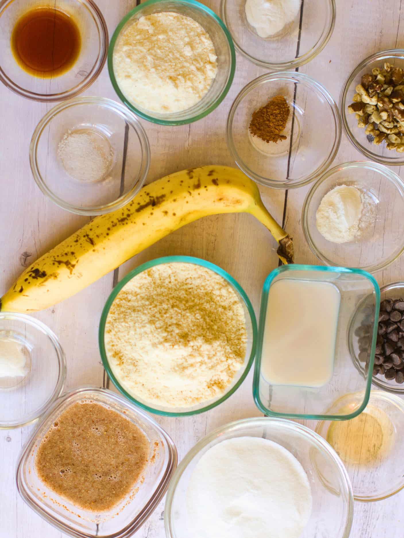 ingredients for keto banana bread laid out on a wooden countertop