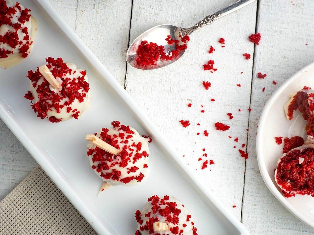 Close-up of several kimchi cake pops arranged on a plate
