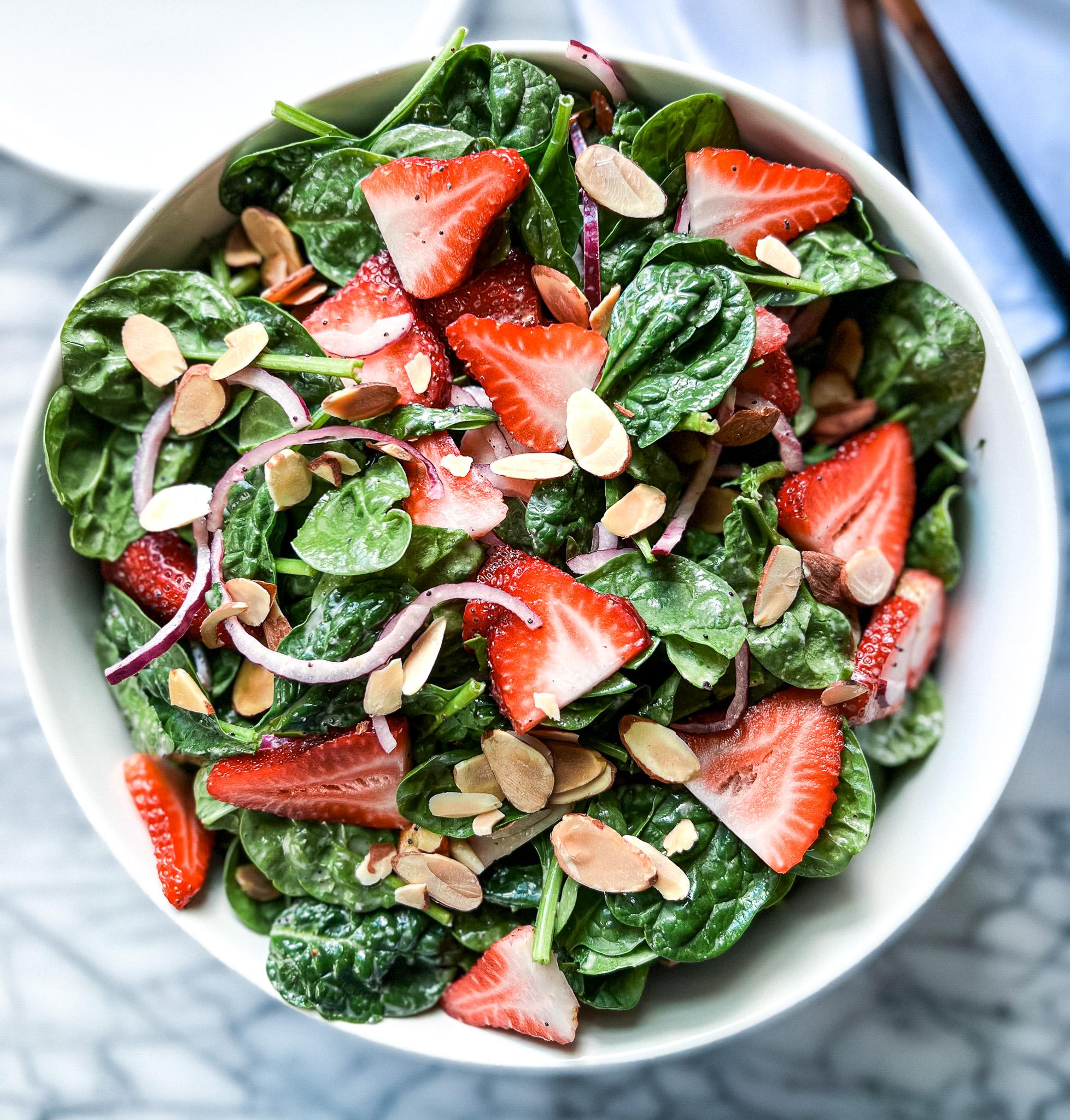 fresh strawberry spinach salad with arugula and poppy seed dressing
