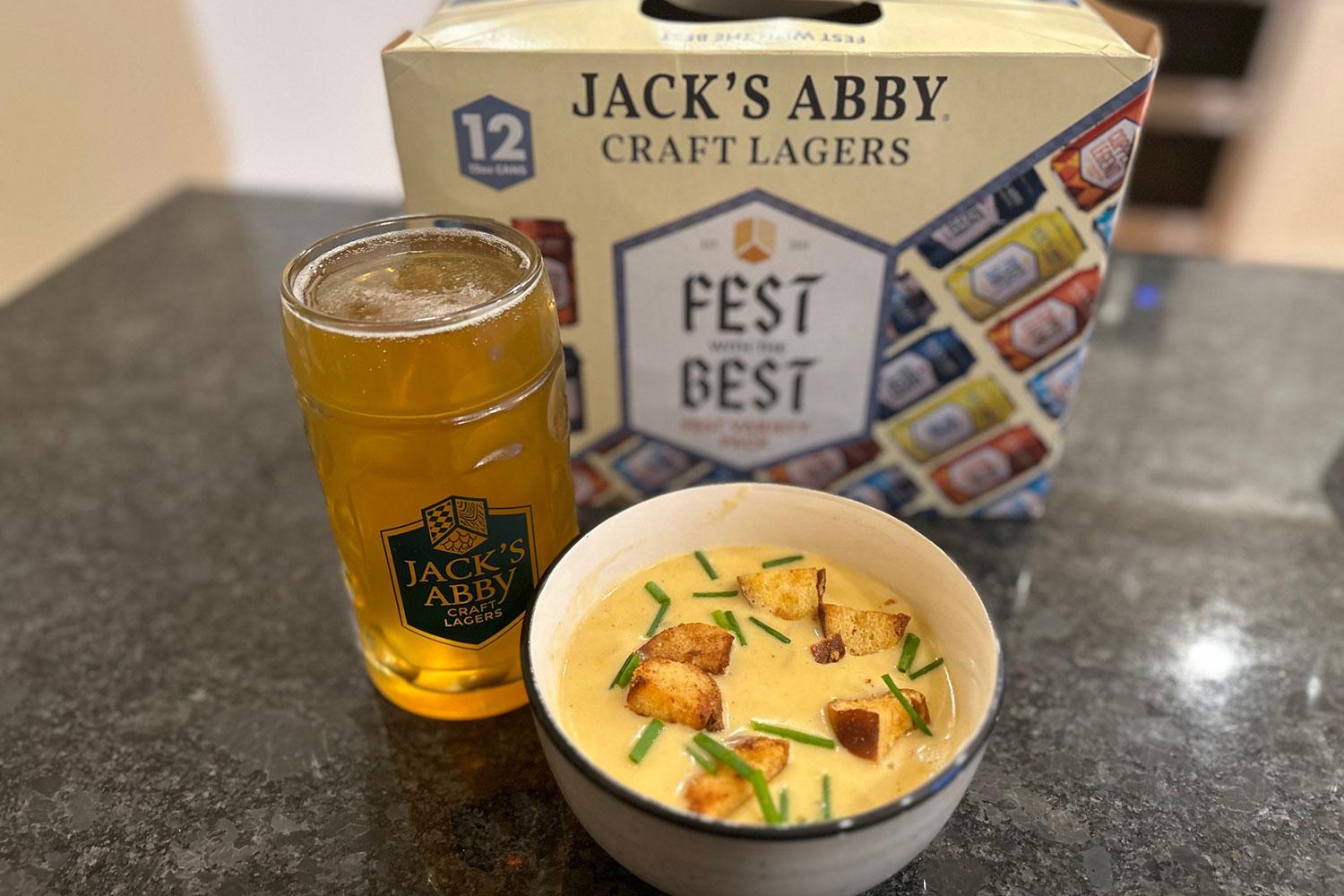 close up of pretzel croutons on top of cheddar ale soup