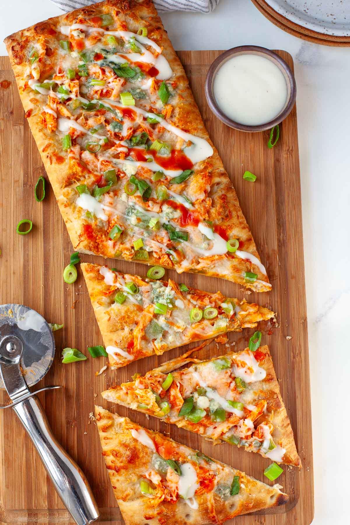 Buffalo Chicken Quinoa Pizza on a wooden board