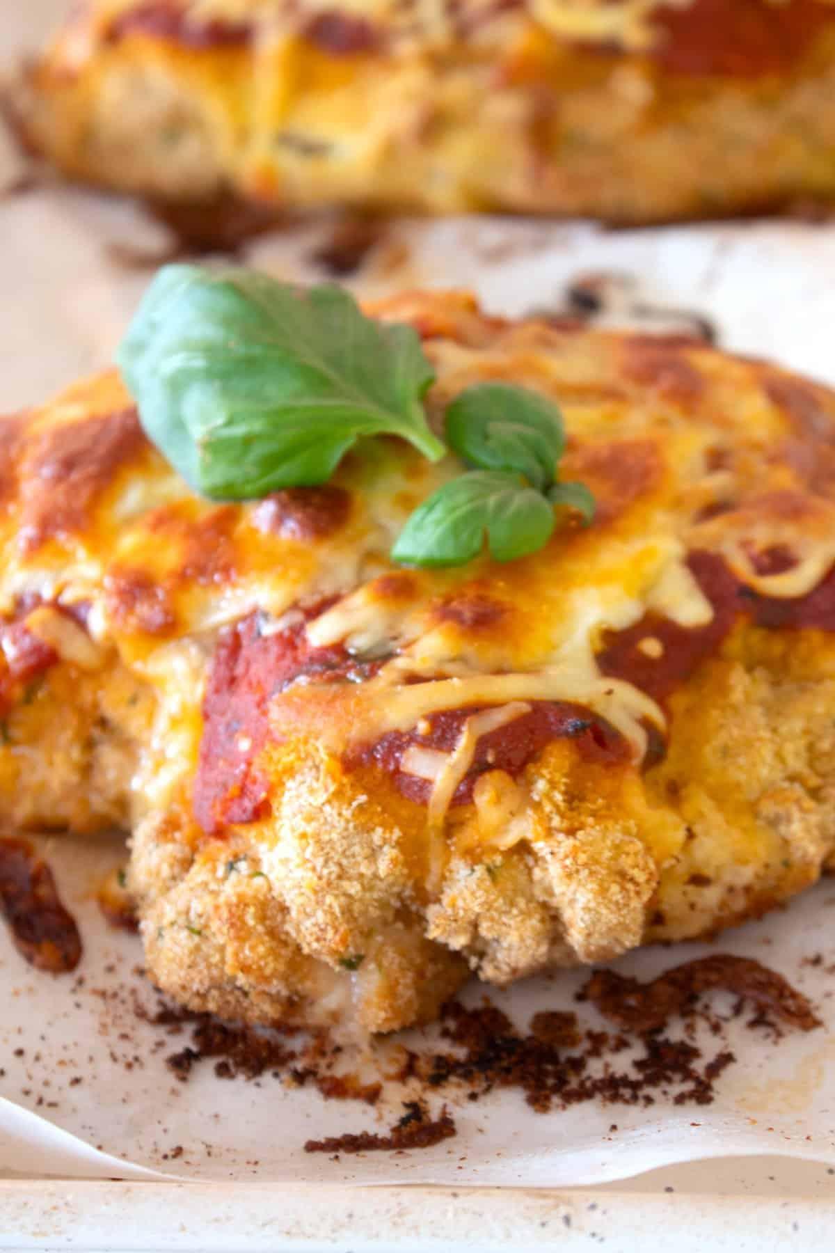close up shot of baked chicken parmesan