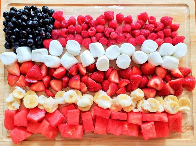 American flag fruit platter on a picnic table