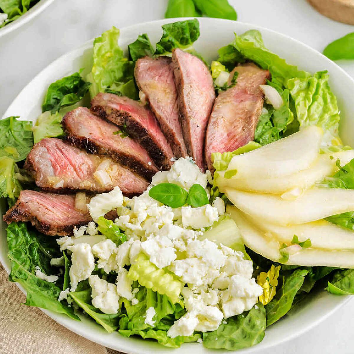 Overhead shot of a beautifully arranged French Country Steak Salad