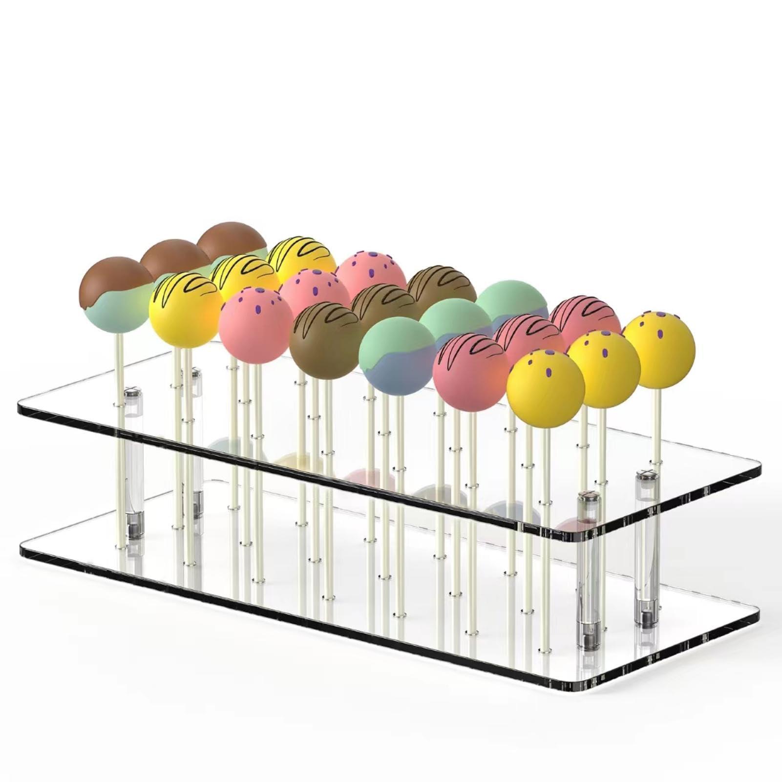 A batch of key lime pie cake pops on a display stand