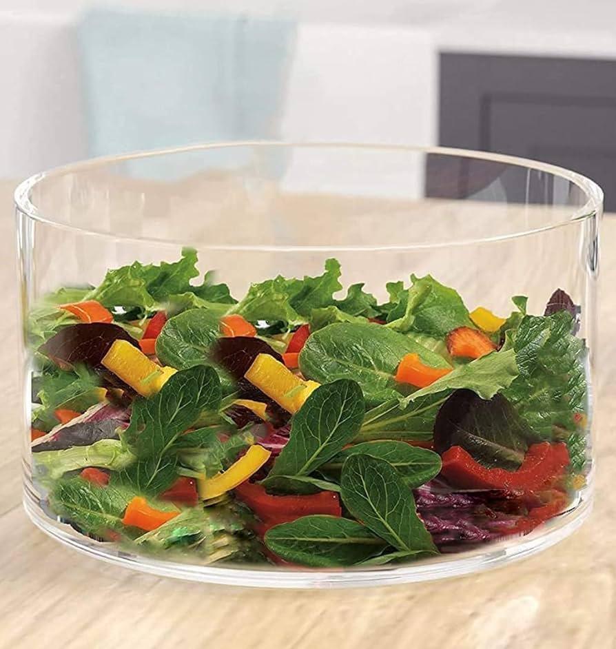 a serving dish with salad in it