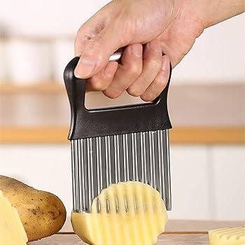 a person cutting vegetables for vegetable fries