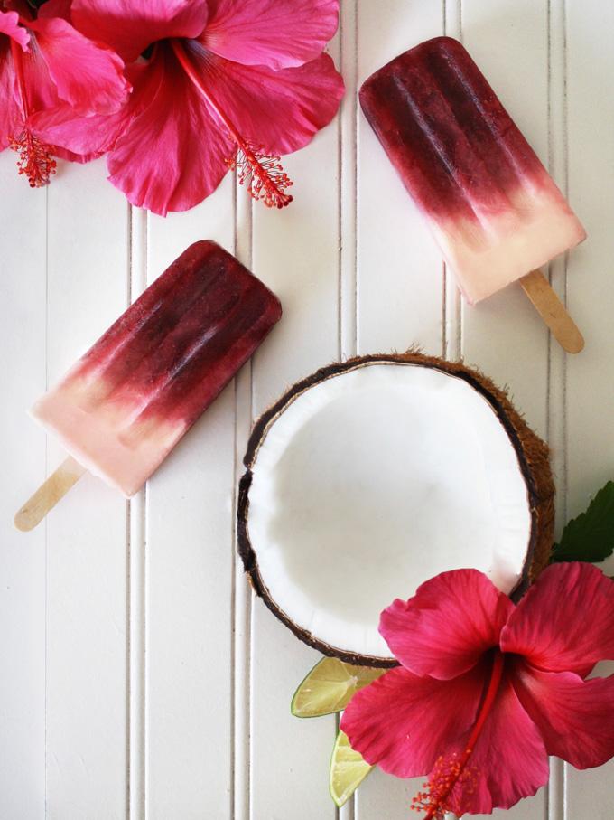 close up of hibiscus tea being poured into popsicle molds