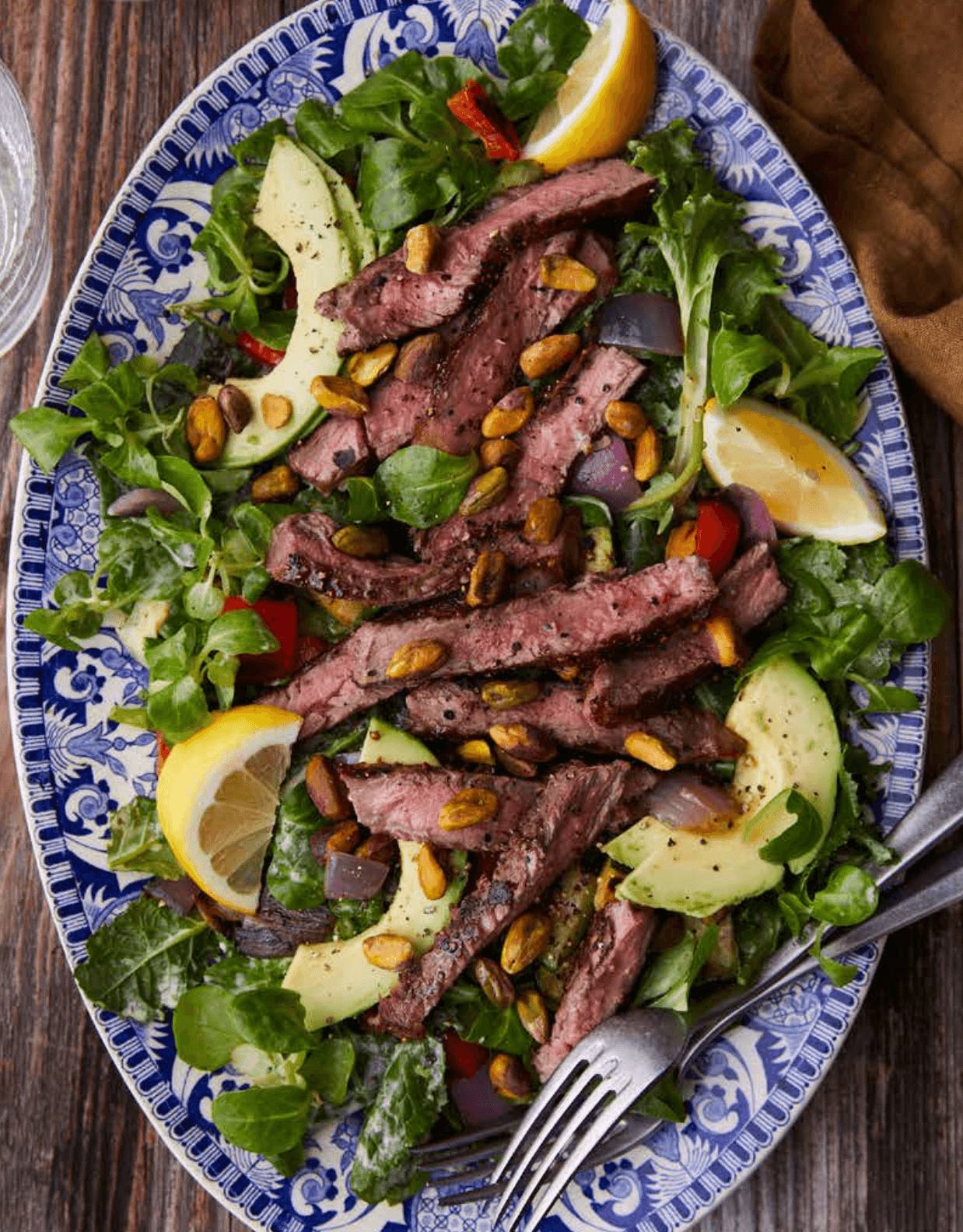 Steak salad with green goddess dressing, beautifully plated