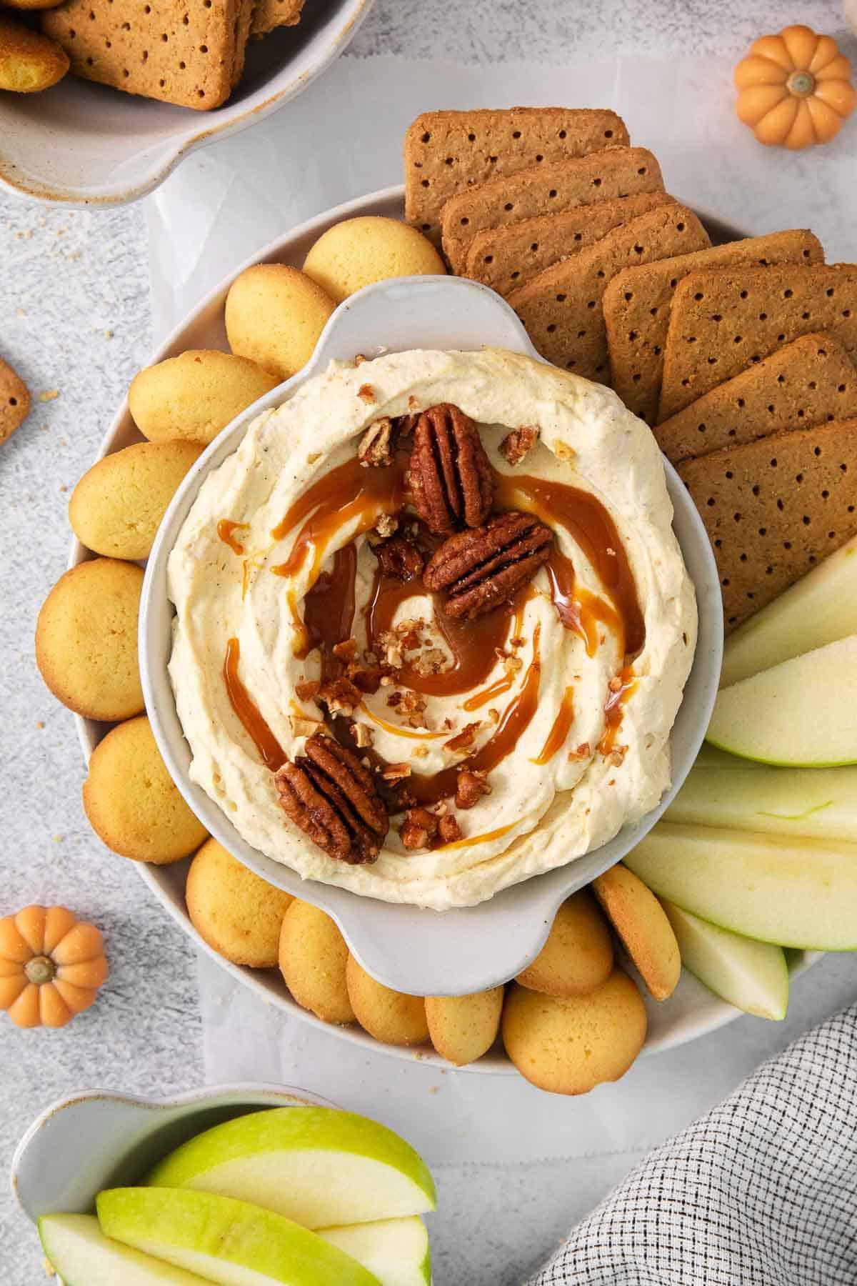 bowl of sugar-free pumpkin cheesecake dip with graham crackers around it