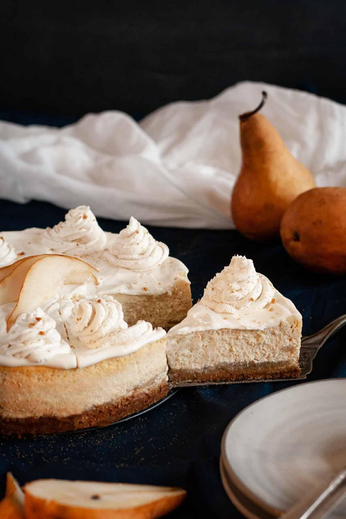 Close-up shot of a slice of Spiced Pear and Ginger Cheesecake Swirl being served