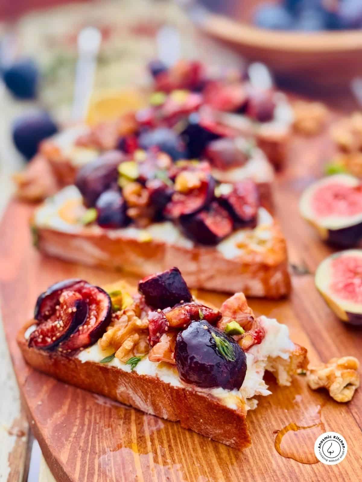 homemade fig balsamic ice cream sandwiches on a wooden board